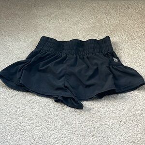 Free people movement shorts in black. Very slight mark on the back. Very light.